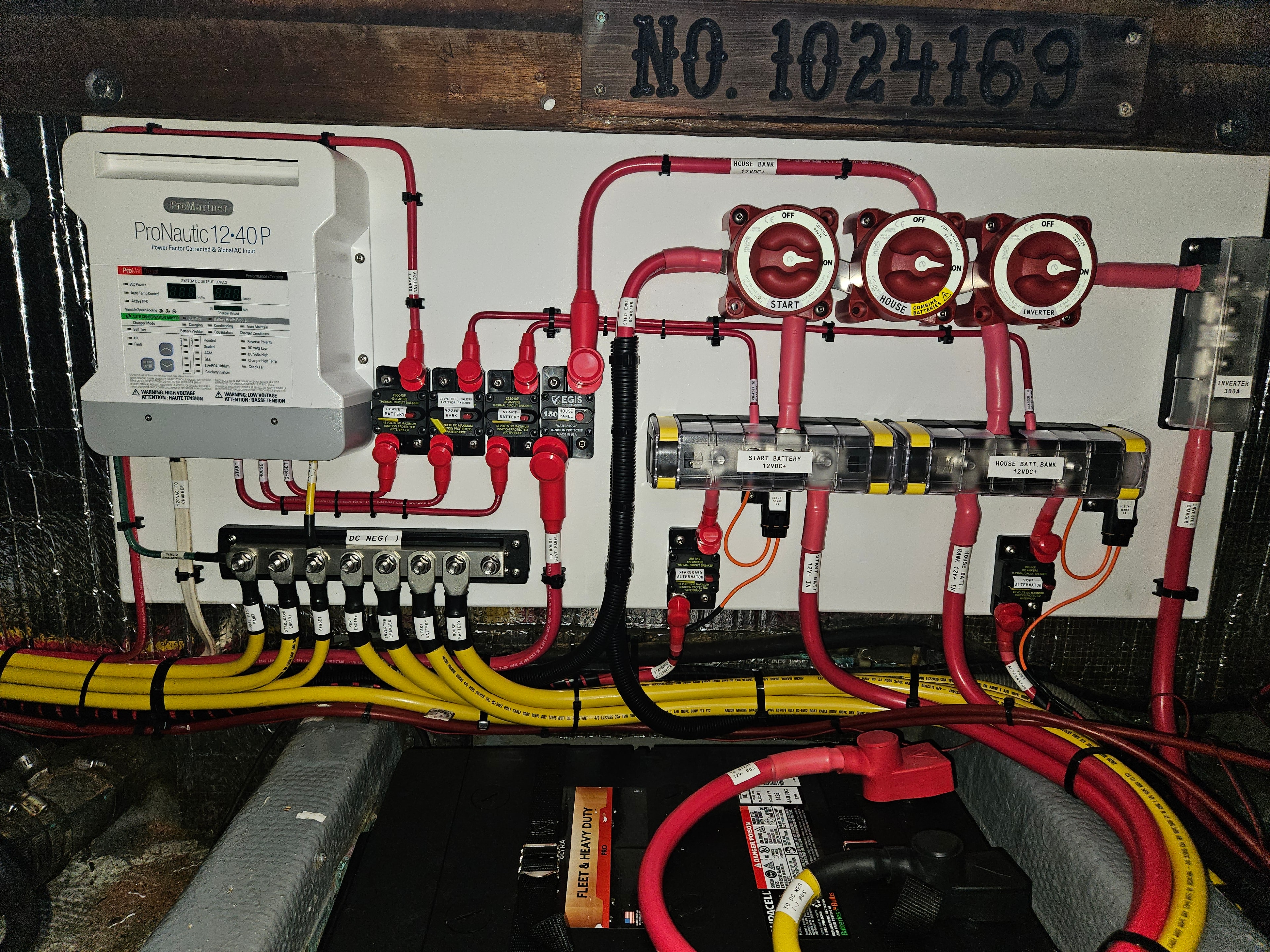 Custom DC primary wiring panel with ProMariner charger and EGIS battery switches