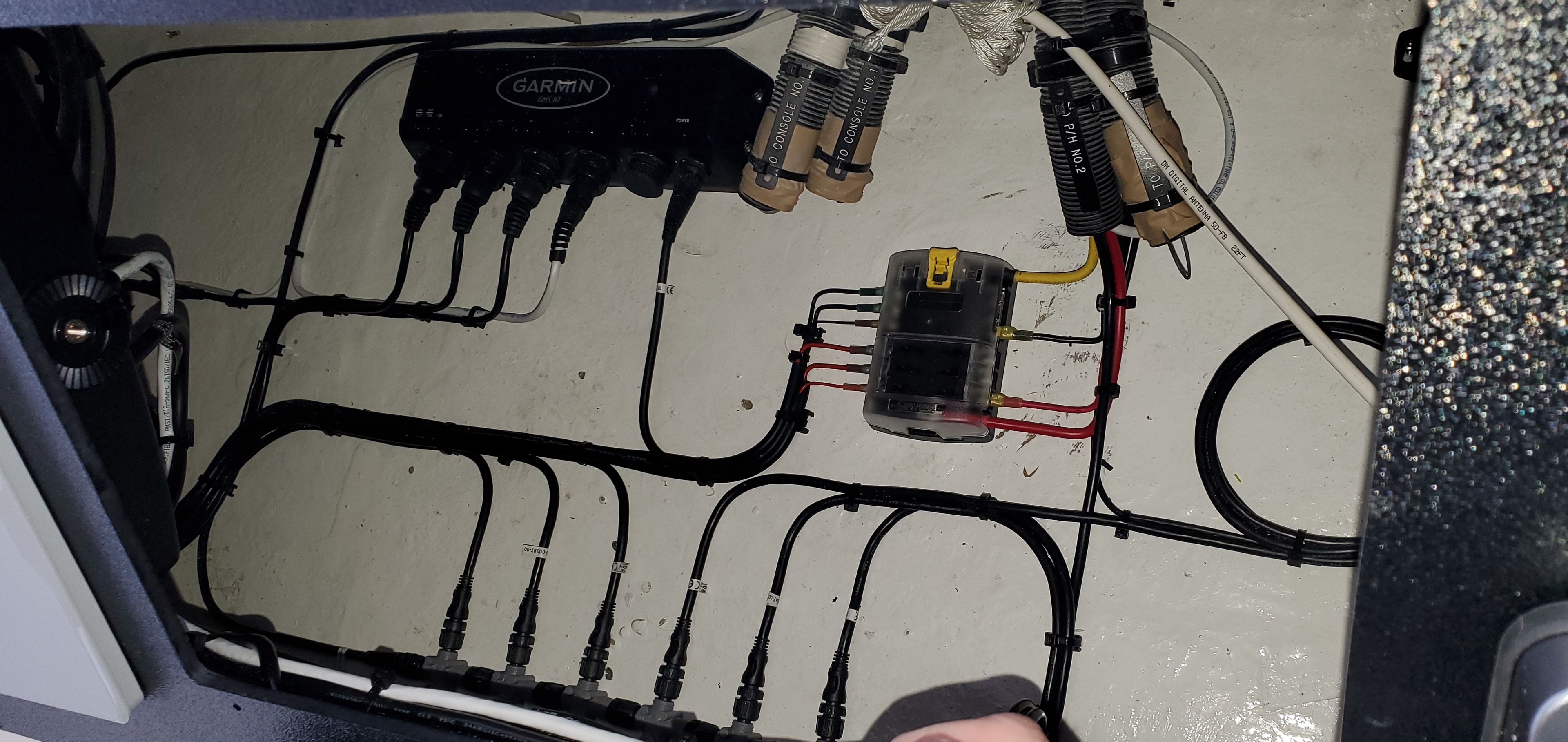Garmin network hub and NMEA wiring behind helm dash