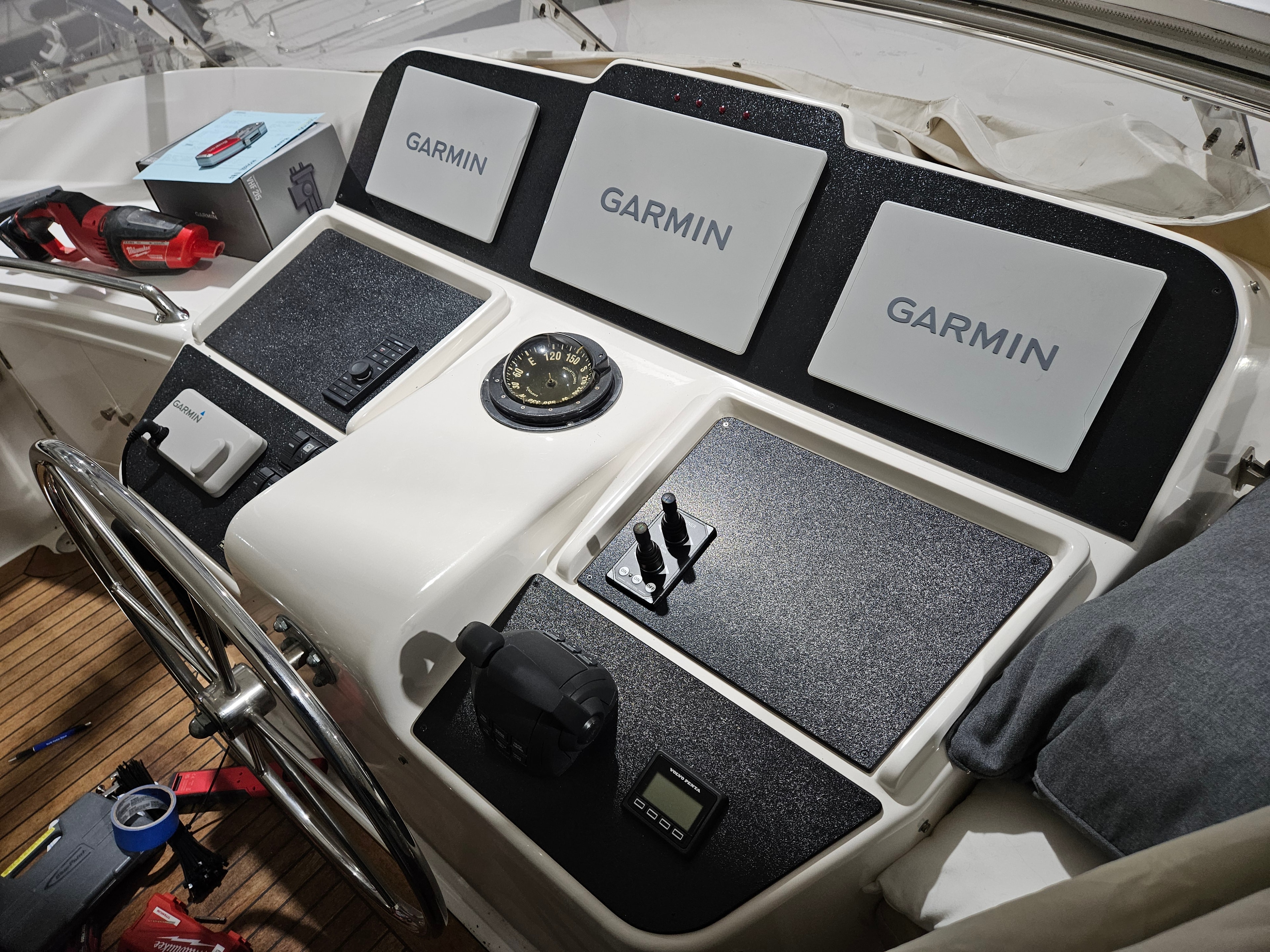 Raven flybridge helm after Garmin electronics upgrade with new dash panel