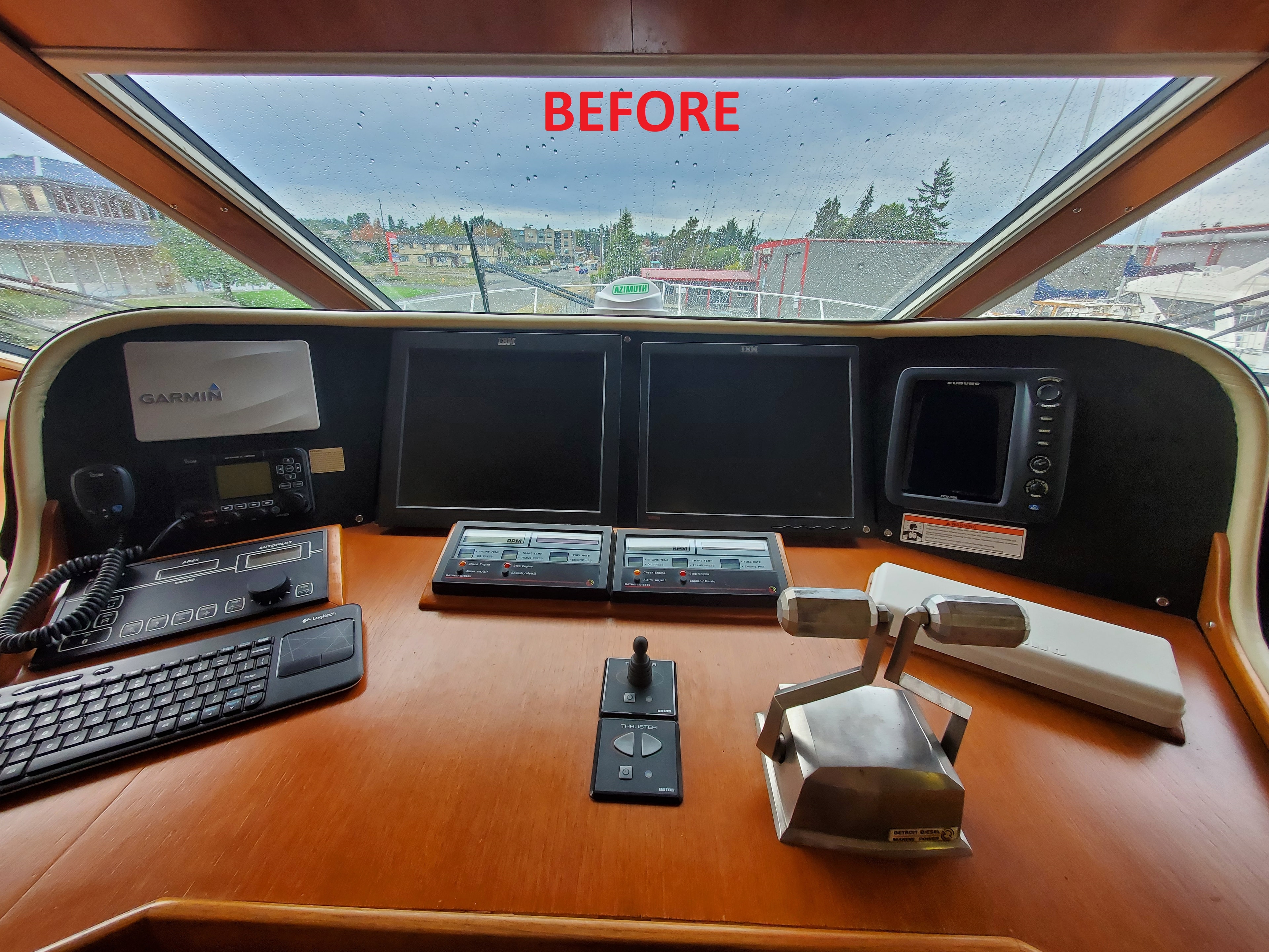 Raven pilothouse helm before electronics upgrade — legacy Garmin and IBM displays