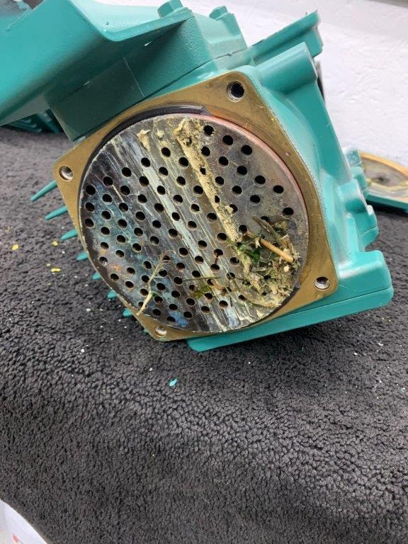 Corroded Volvo Penta heat exchanger end cap removed for cleaning and inspection