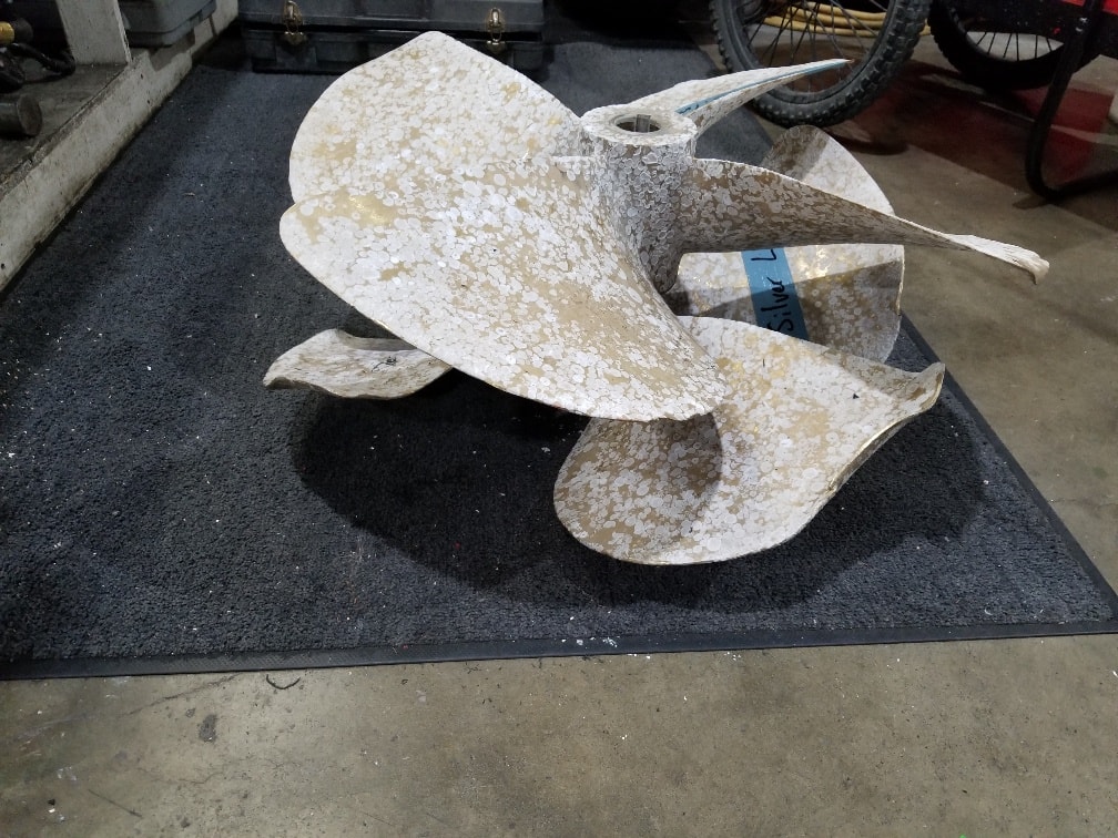 Large barnacle-encrusted propeller removed for service