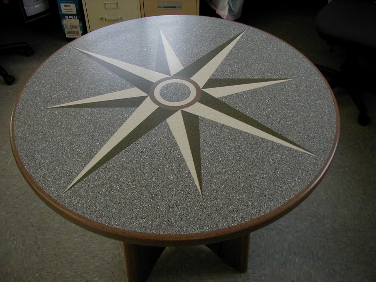 Custom Corian compass rose table fabricated for yacht interior